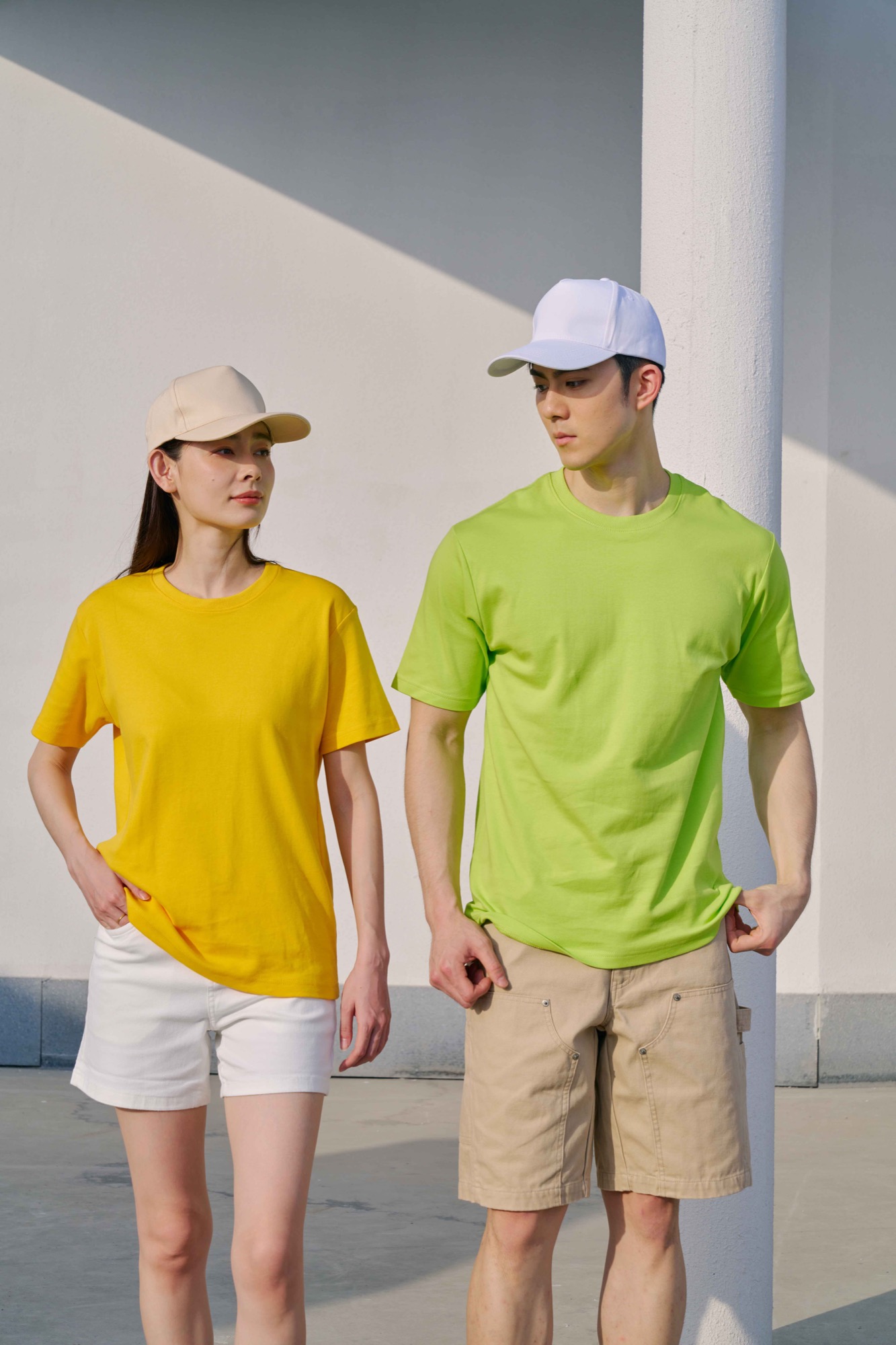 Models wearing yellow and lime green RC06 cotton interlock T-shirts