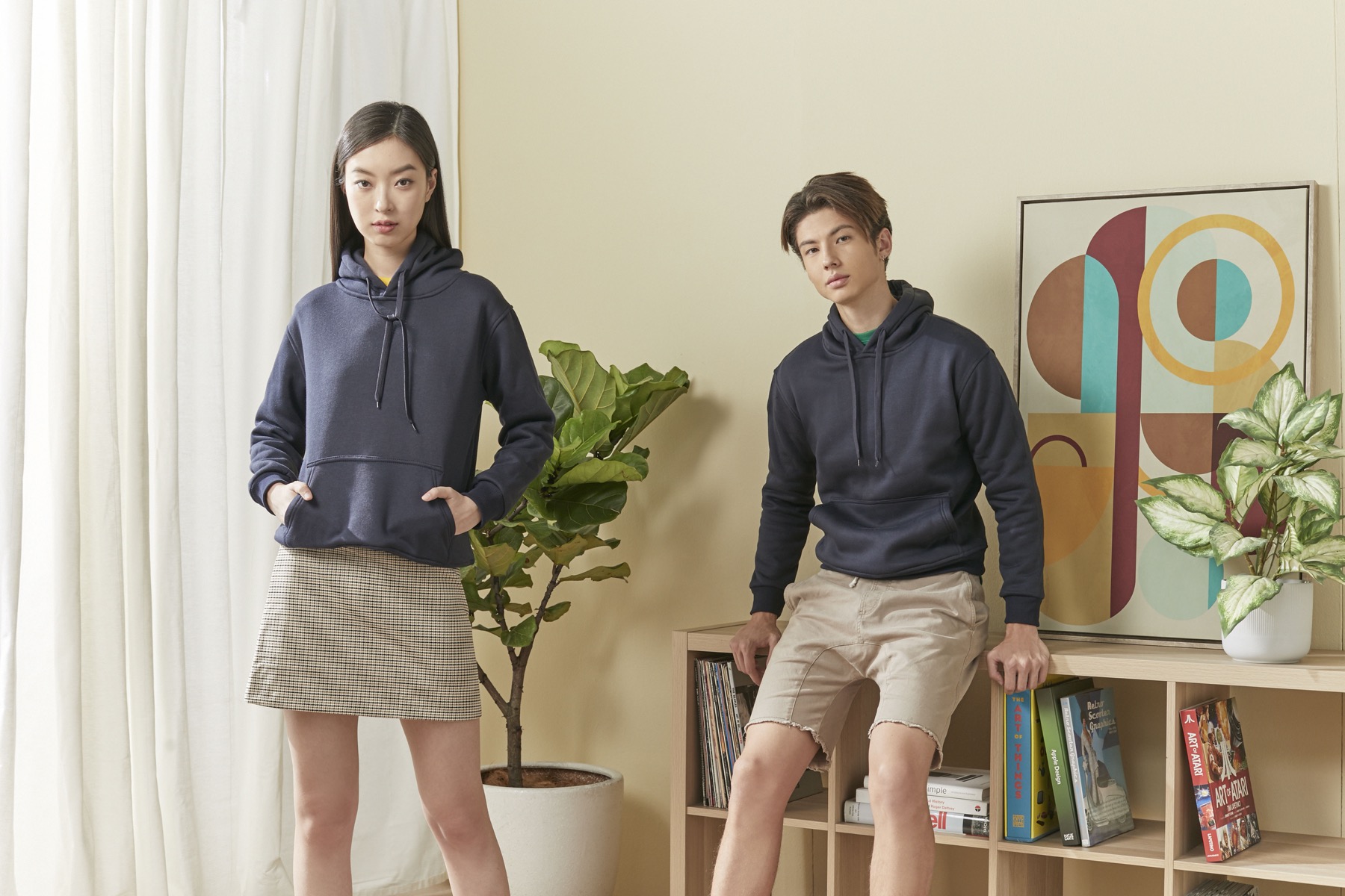 Models wearing navy FJ02 pullover hoodies