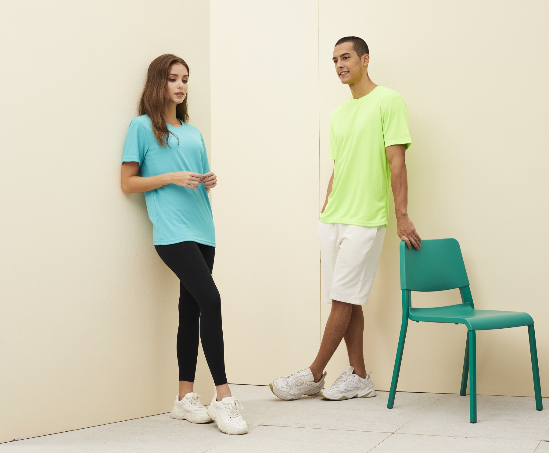 Models wearing aqua and neon green RM01 microfiber round neck T-shirts